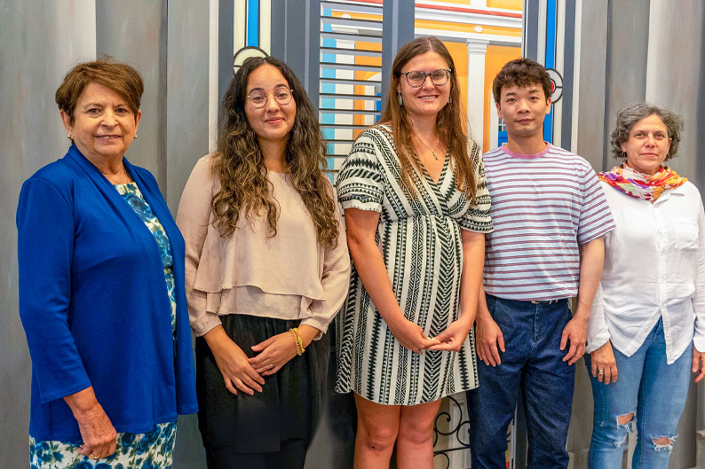 From left, Gladys Gomez Rossie with the Cuban Heritage Collection, stands with fellows Lidia Hernandez, Katie Coldiron, Xu Peng, and Maytte Hernandez Lorenzo. 